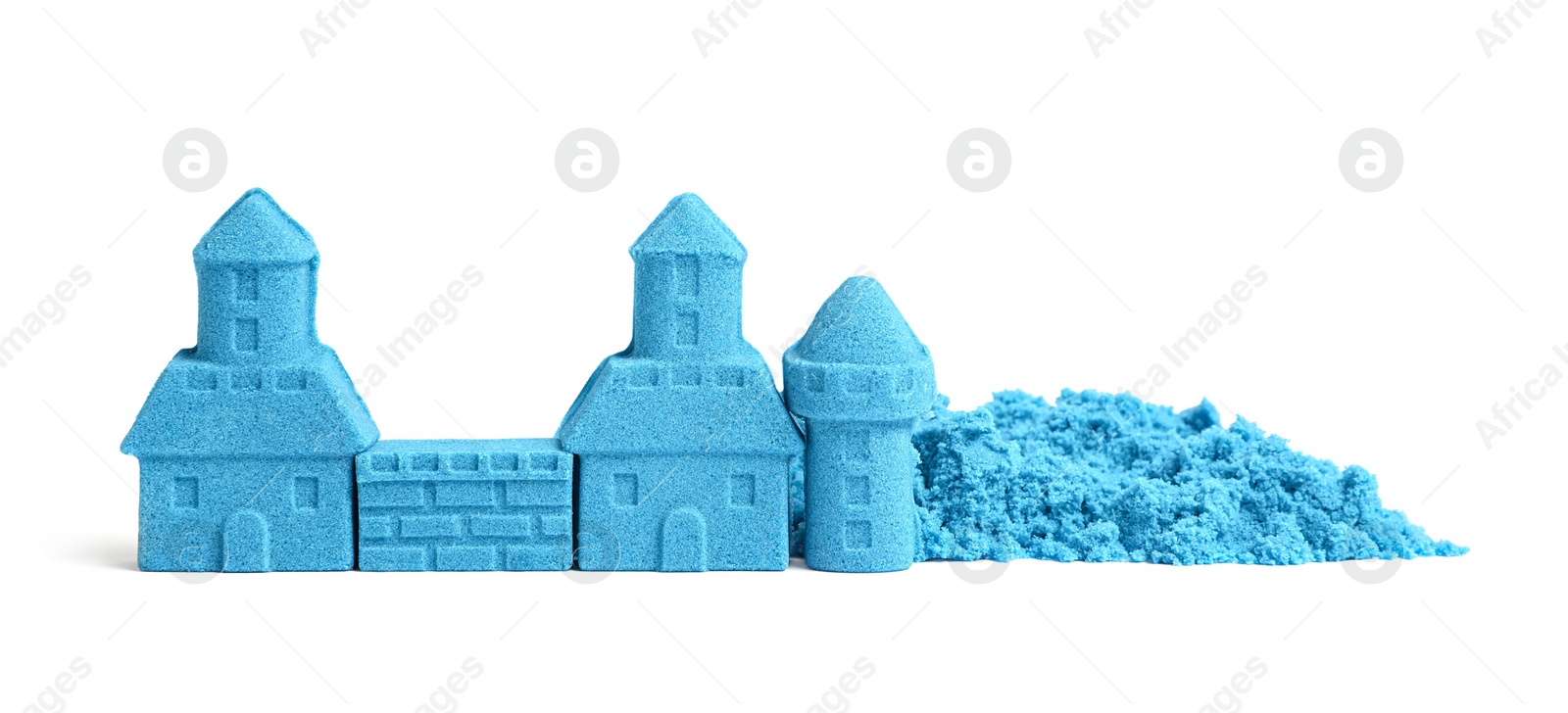 Photo of Castle made of blue kinetic sand isolated on white