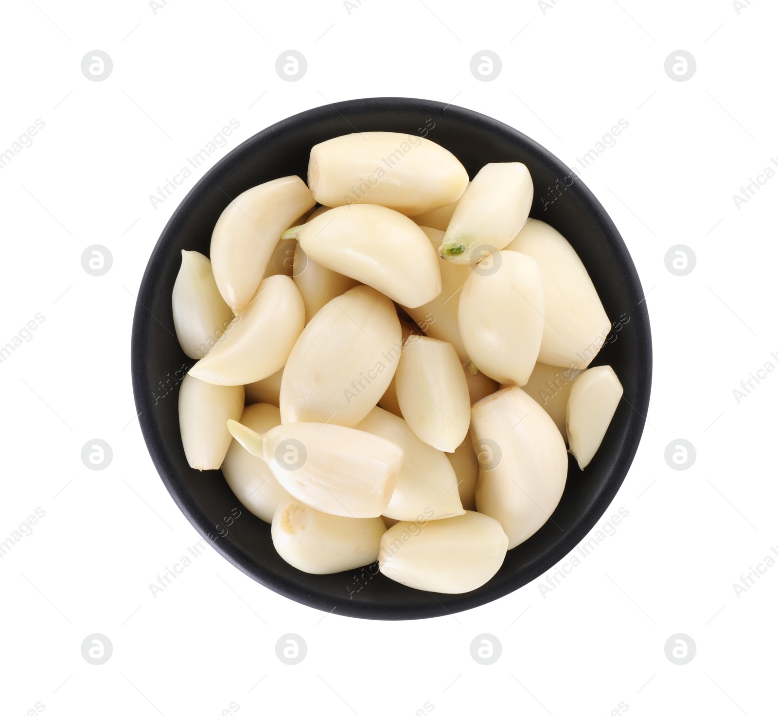 Photo of Peeled cloves of fresh garlic in bowl isolated on white, top view