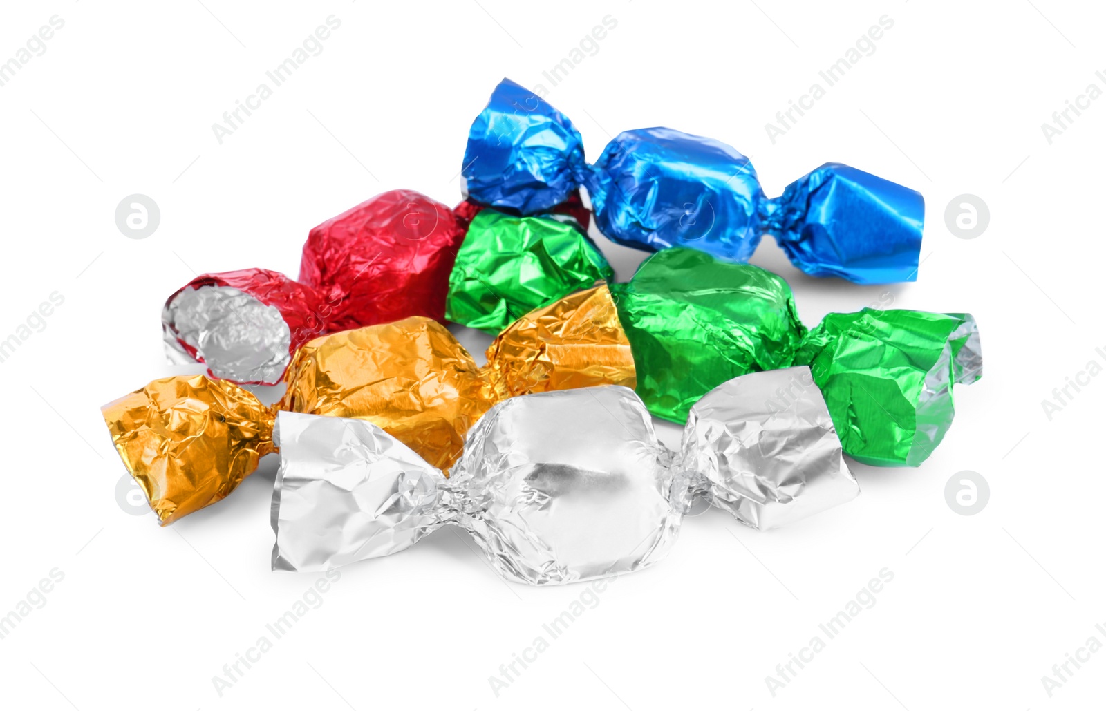 Photo of Tasty candies in colorful wrappers isolated on white