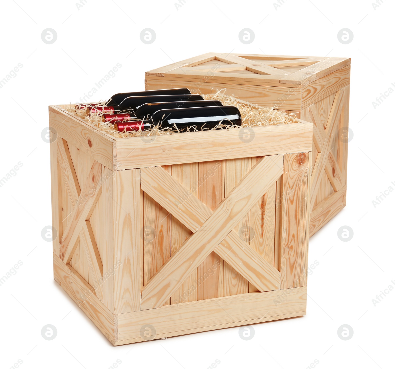 Photo of Wooden crates with bottles of wine isolated on white