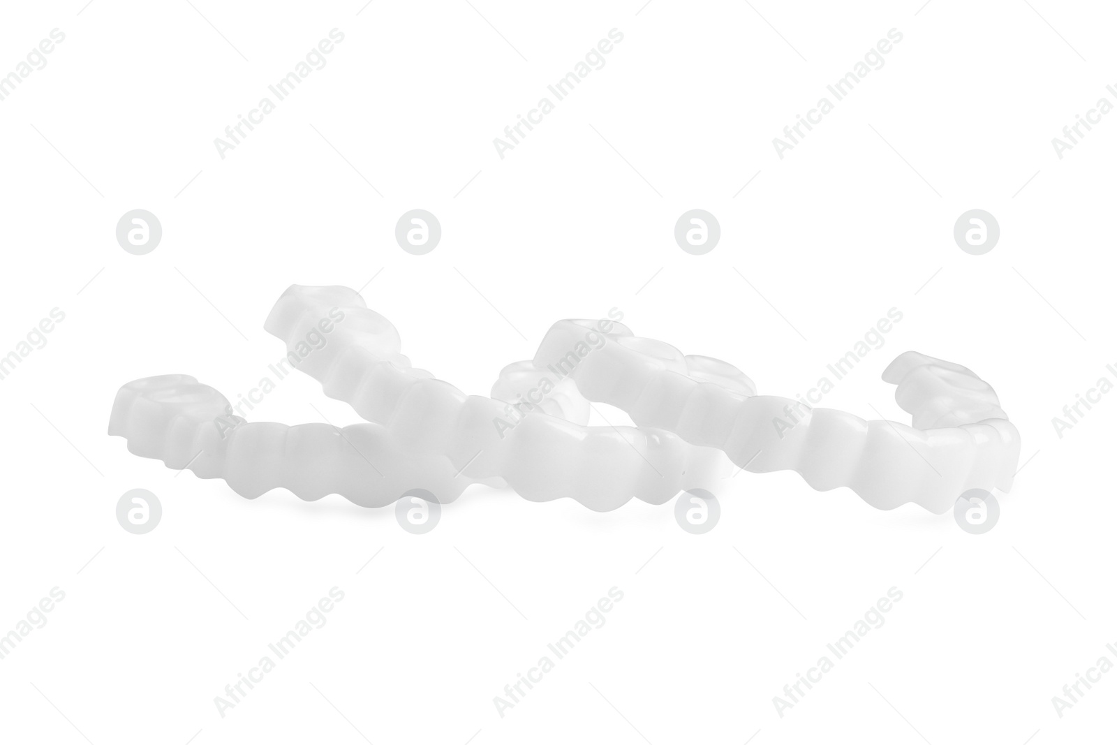 Photo of Dental mouth guards on white background. Bite correction