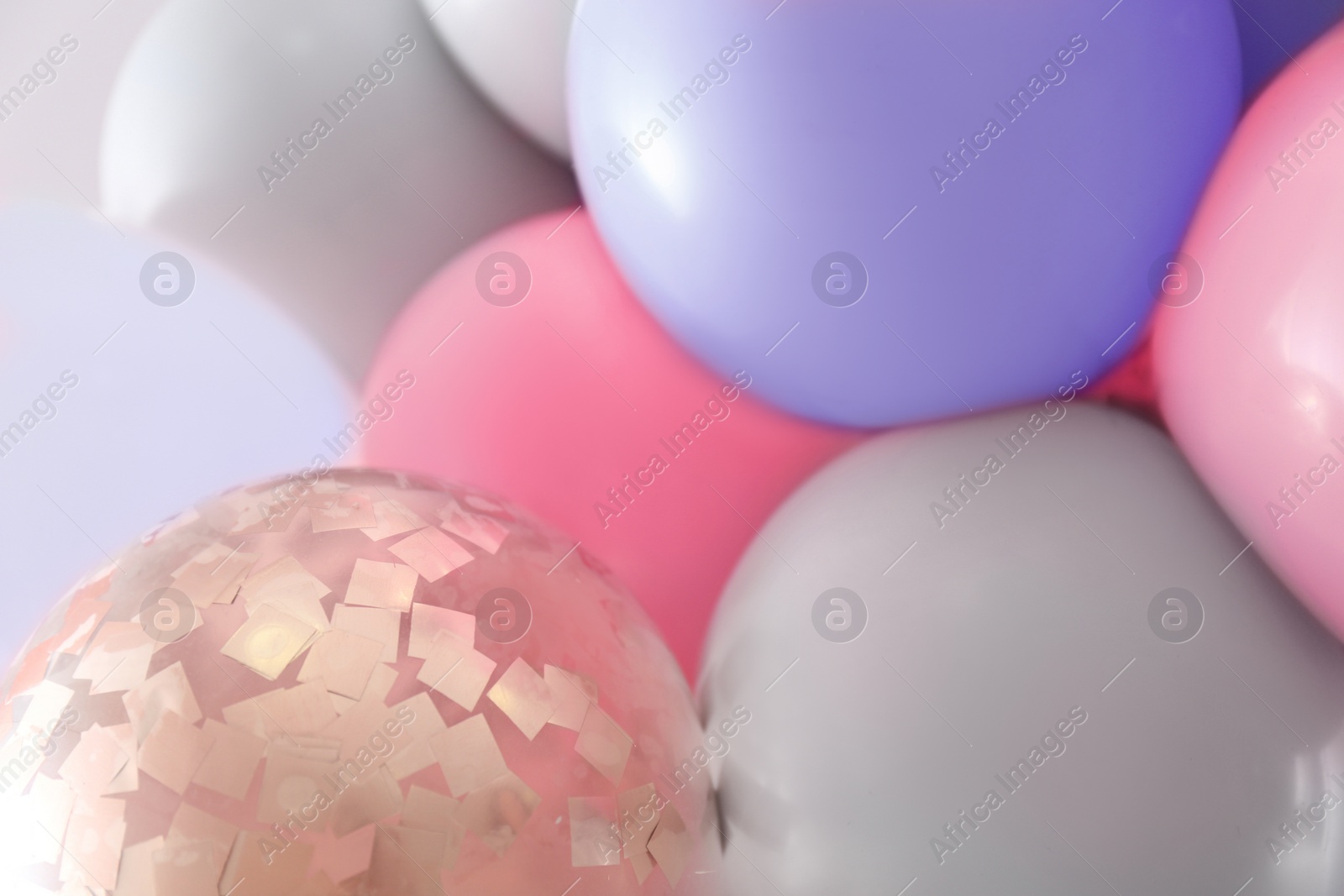 Image of Beautiful colorful balloons on light background, closeup. Party decor