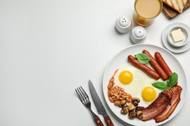 Photo of Traditional English breakfast with fried eggs on light table, flat lay. Space for text
