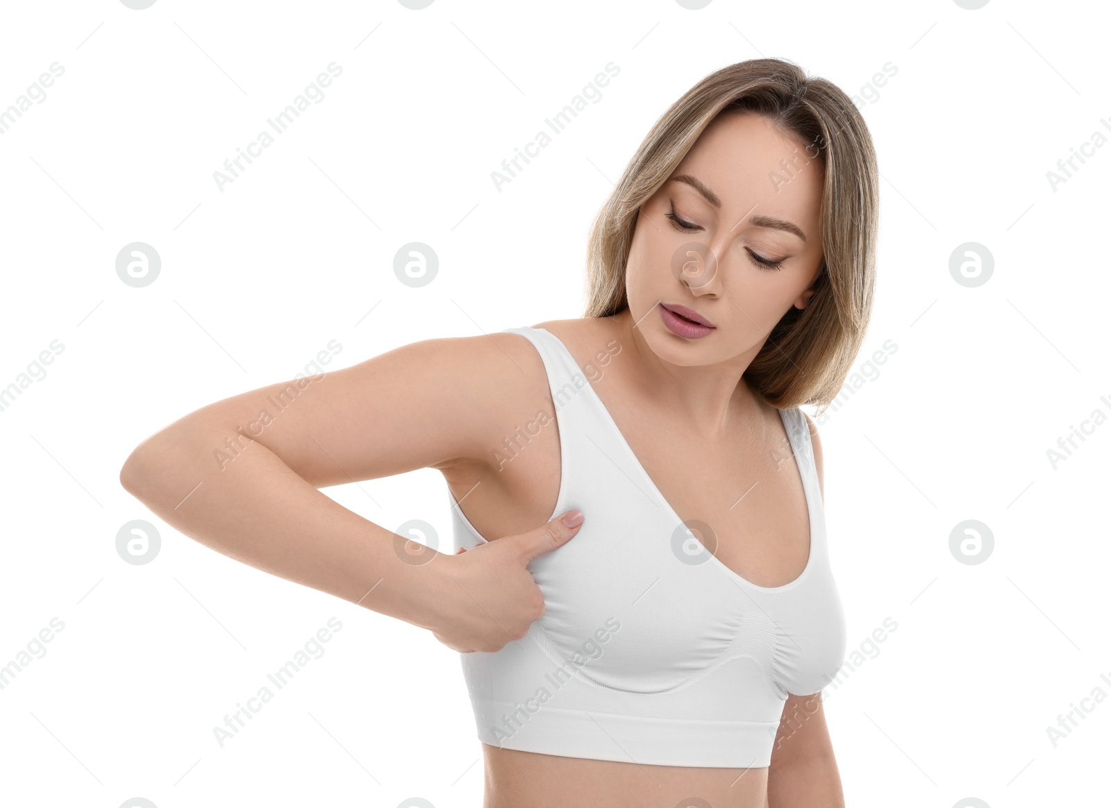 Photo of Mammology. Young woman doing breast self-examination on white background