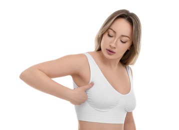 Photo of Mammology. Young woman doing breast self-examination on white background