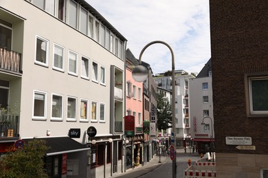 Cologne, Germany - August 28, 2022: Beautiful residential buildings on city street