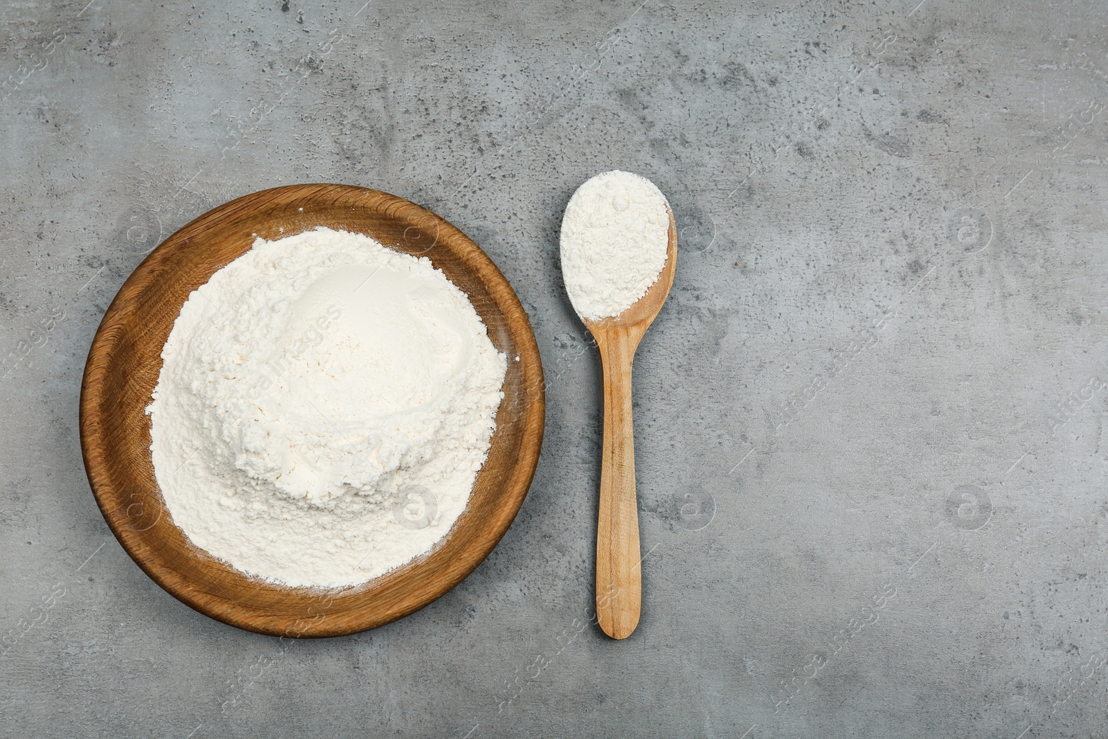 Photo of Flour on light grey background, flat lay. Space for text