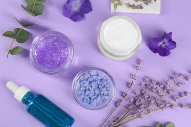 Photo of Flat lay composition with homemade cosmetic products and fresh ingredients on violet background