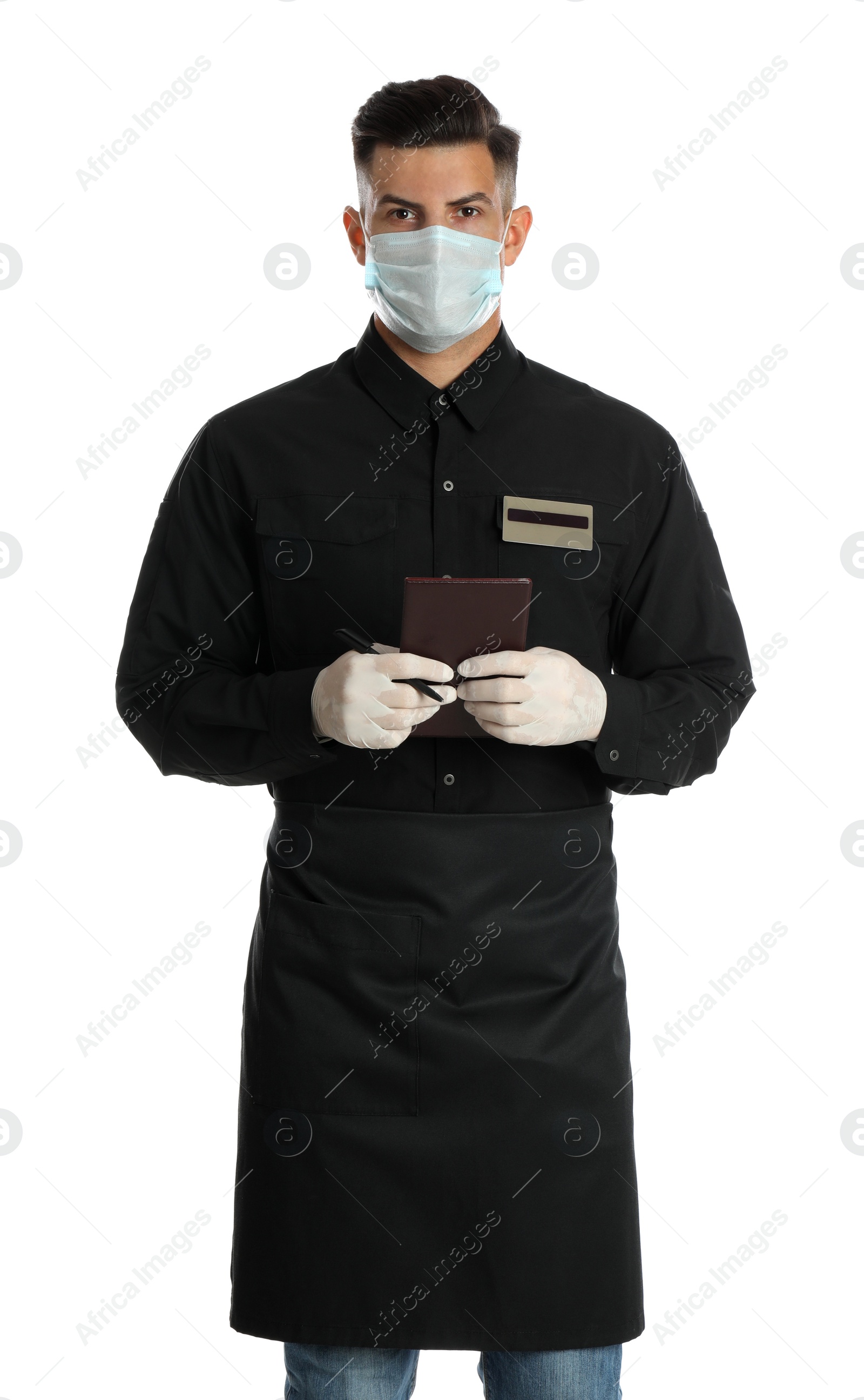 Photo of Waiter in medical face mask with notepad on white background