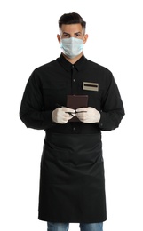 Photo of Waiter in medical face mask with notepad on white background