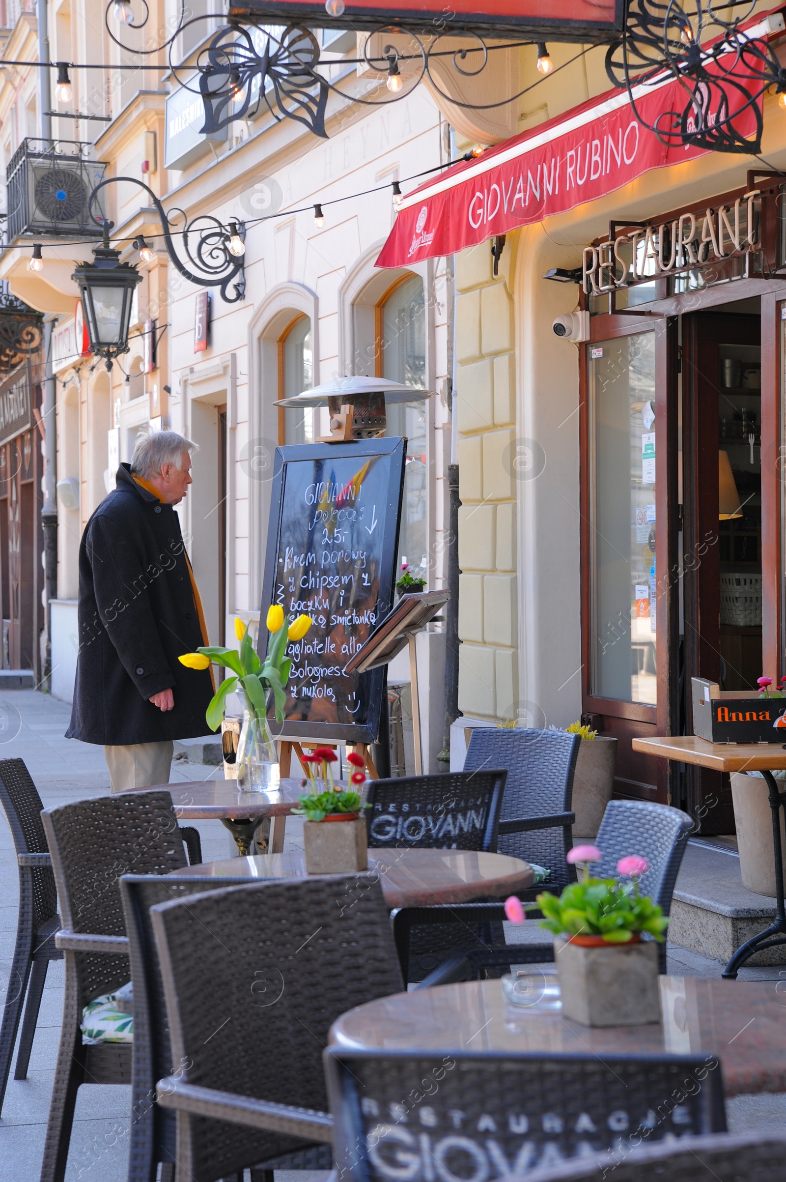 Photo of WARSAW, POLAND - MARCH 22, 2022: Beautiful view of modern cafe with outdoor terrace