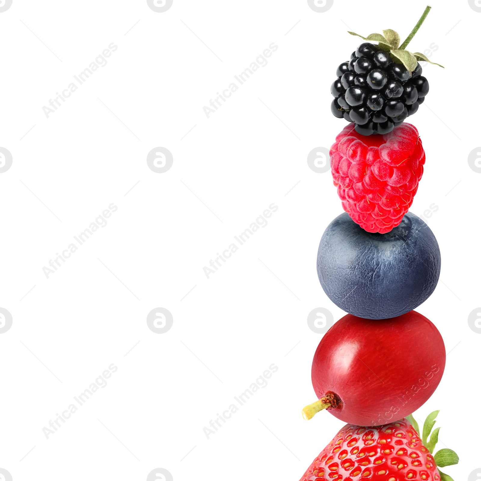 Image of Stack of different fresh tasty berries on white background