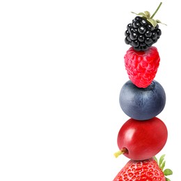 Stack of different fresh tasty berries on white background
