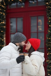 Photo of Lovely couple spending time together on city street