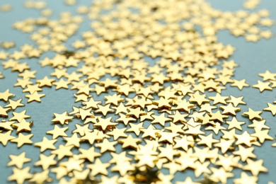 Confetti stars on grey background, closeup. Christmas celebration