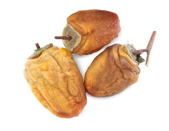 Tasty dried persimmon fruits on white background, top view