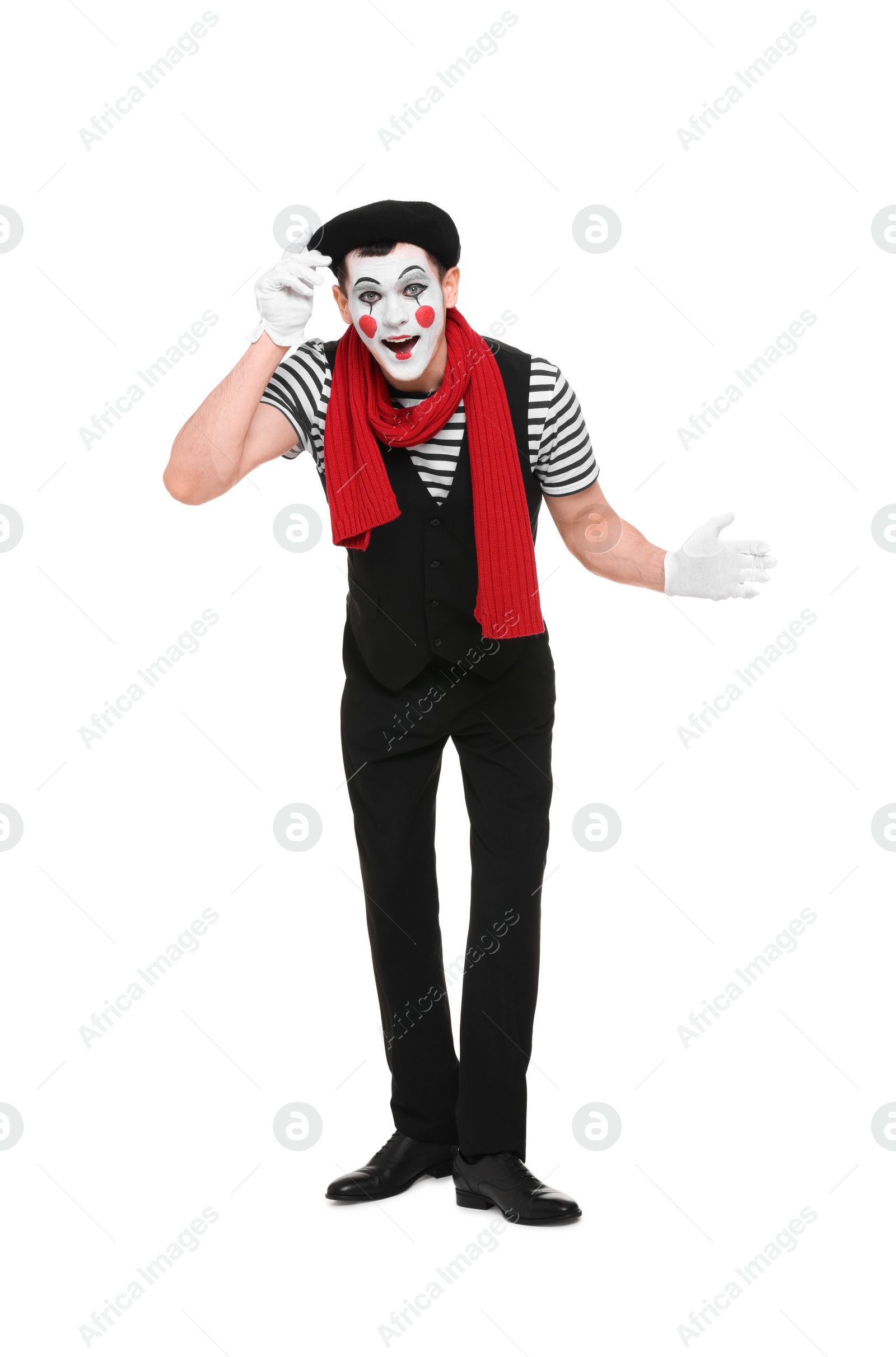 Photo of Funny mime artist in beret posing on white background