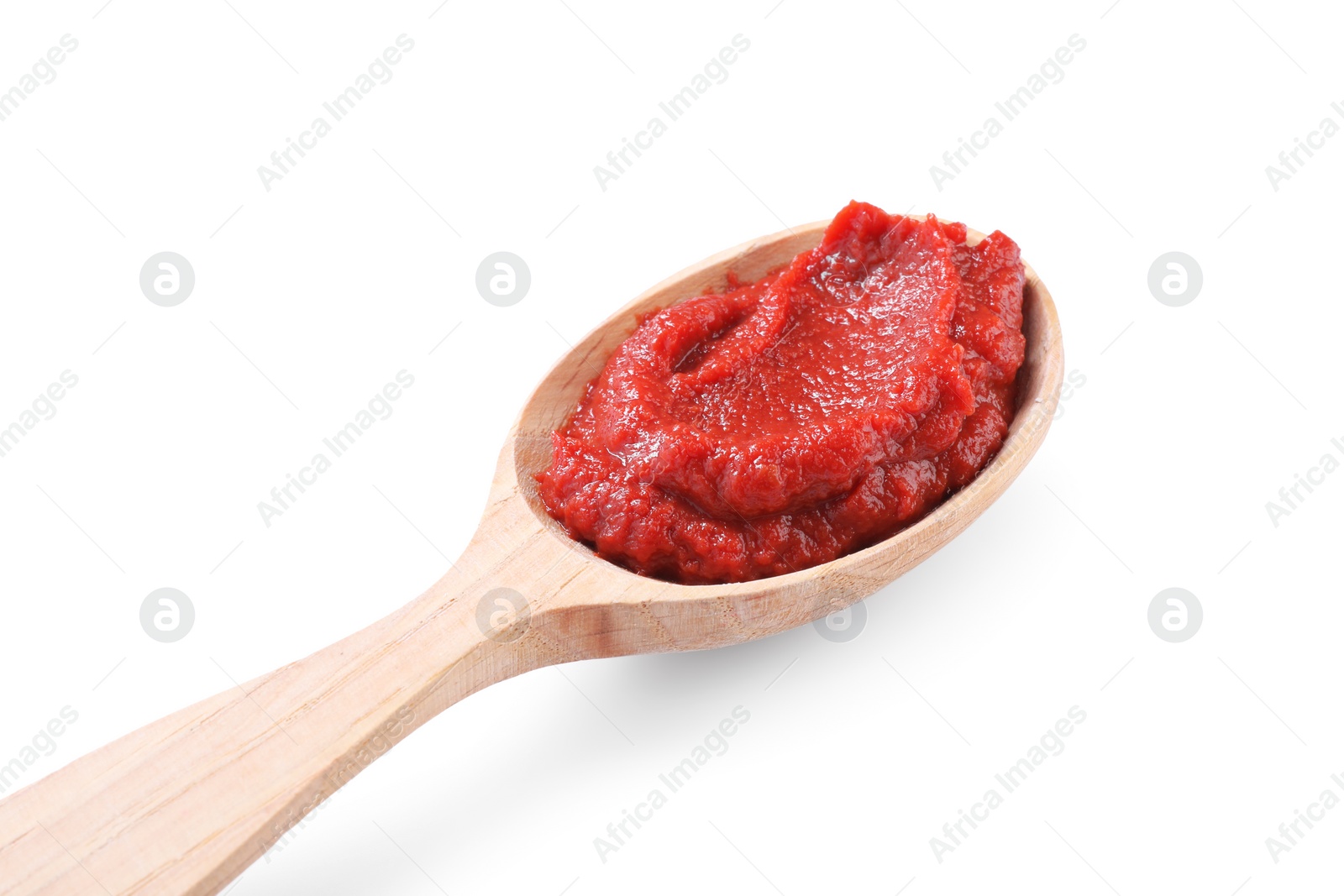 Photo of Wooden spoon of tasty tomato paste isolated on white