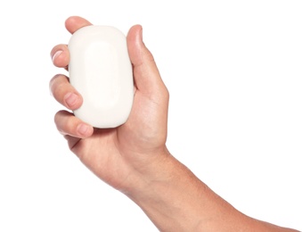 Man holding soap bar on white background