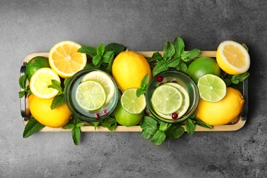 Flat lay composition with detox lemonade and ingredients on grey background