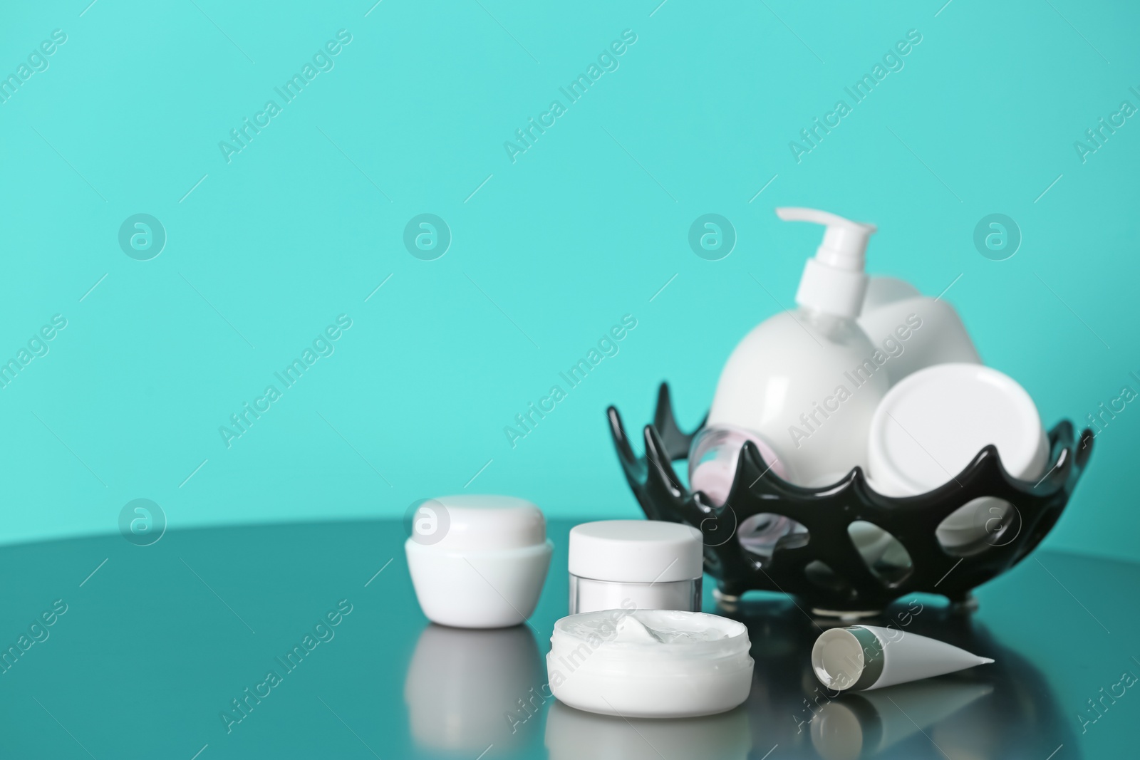 Photo of Set of body care cosmetics on table