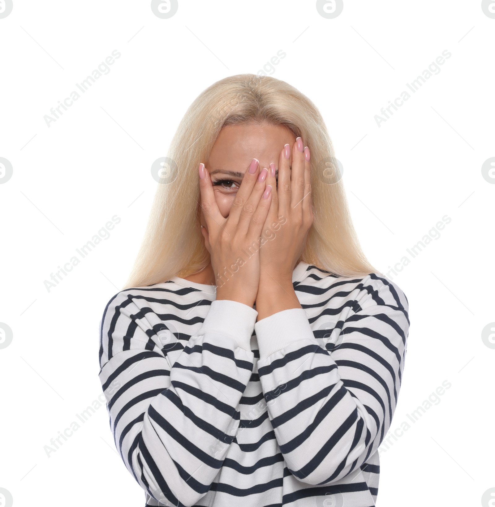 Photo of Embarrassed woman covering face with hands on white background