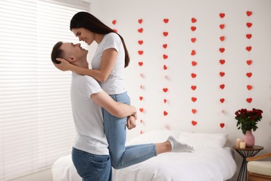 Photo of Lovely couple spending time together at home. Valentine`s day celebration
