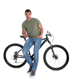 Handsome young man with modern bicycle on white background