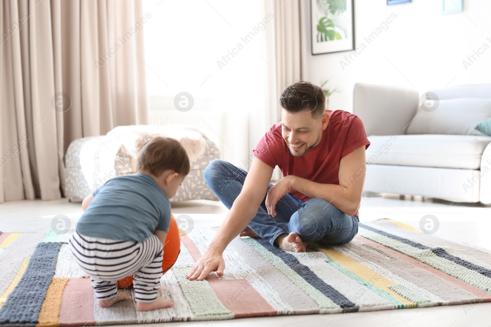 Photo of Dad and his son playing at home