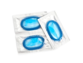 Photo of Condom packages on white background, top view. Safe sex