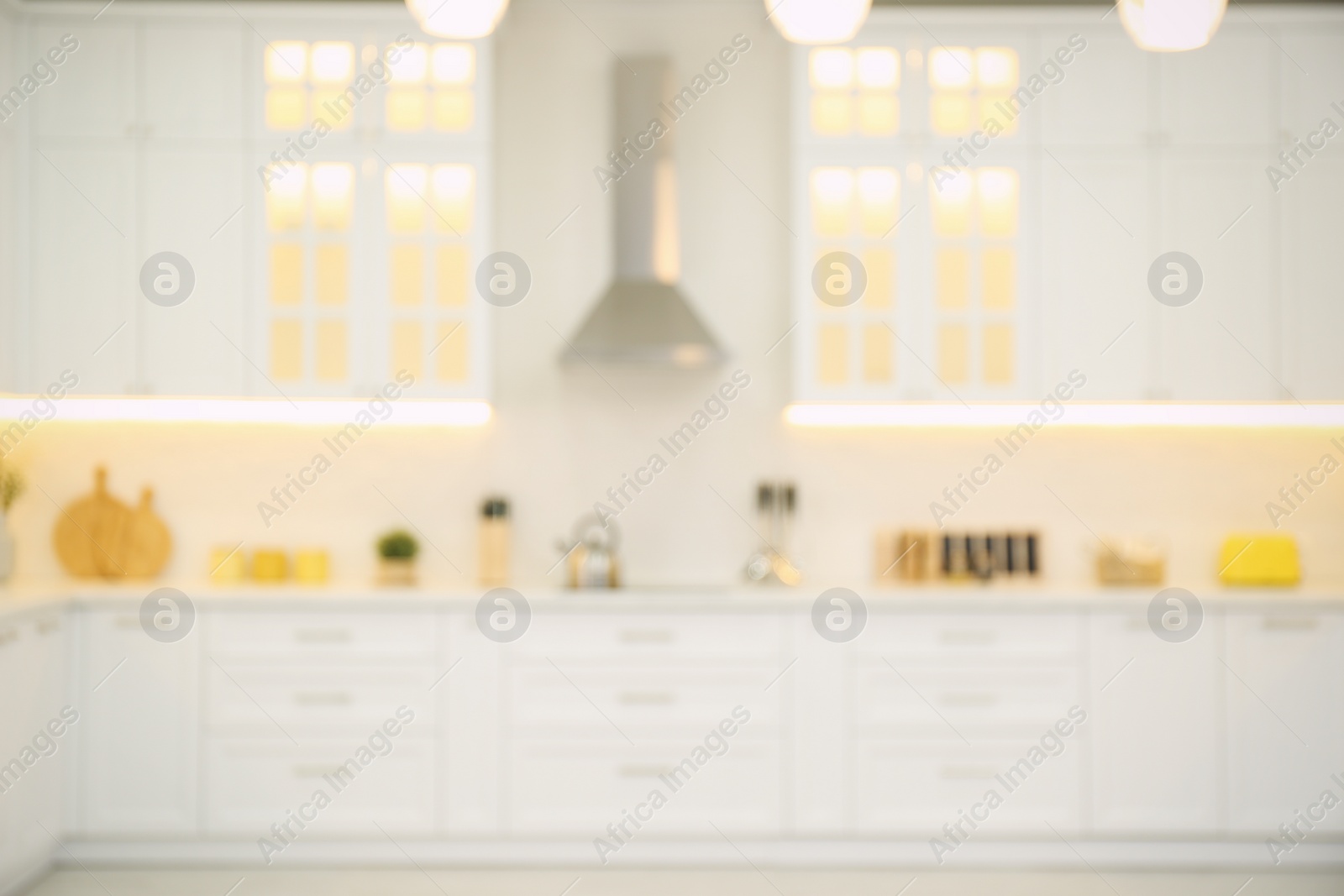 Photo of Blurred view of modern kitchen interior with stylish furniture