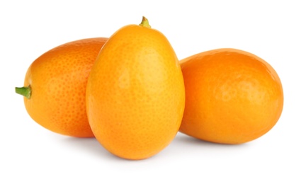 Photo of Fresh ripe kumquats on white background. Exotic fruit