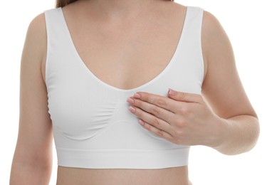 Photo of Mammology. Young woman doing breast self-examination on white background, closeup