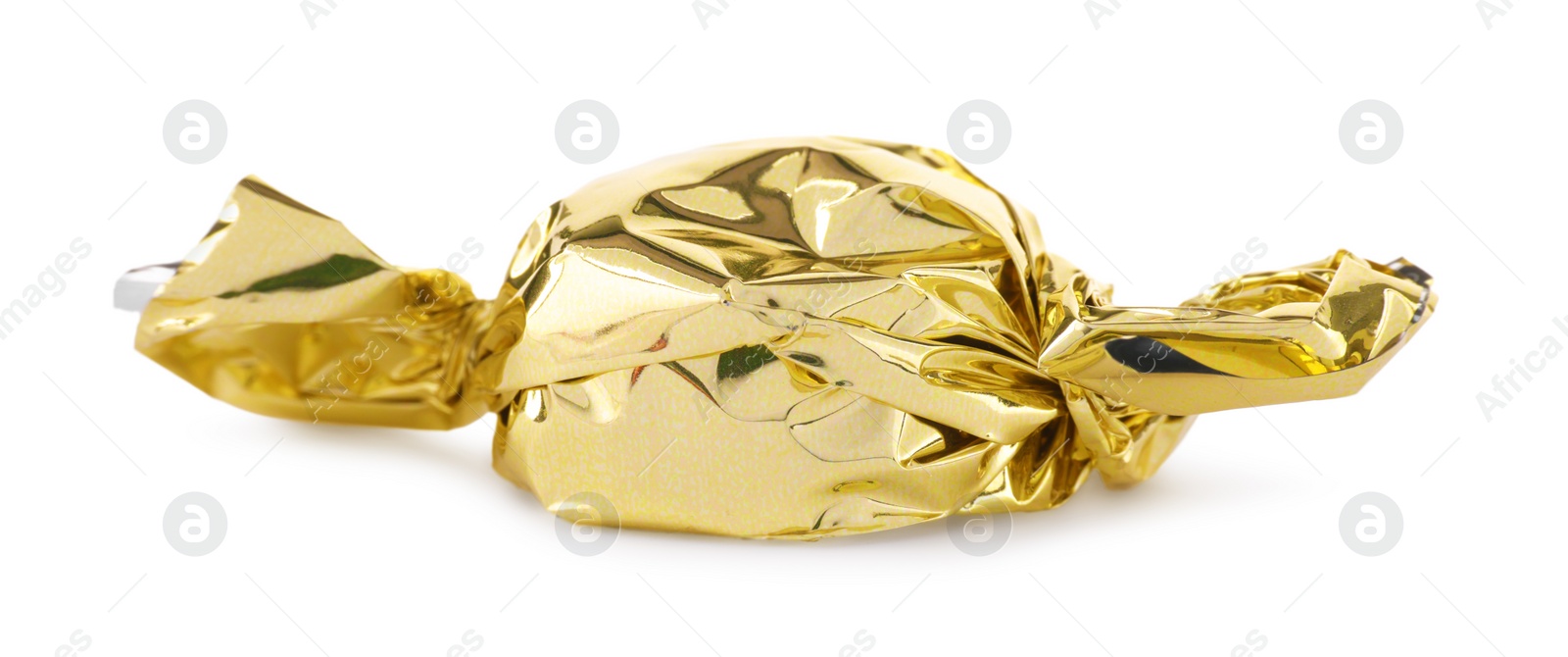 Photo of Candy in golden wrapper isolated on white