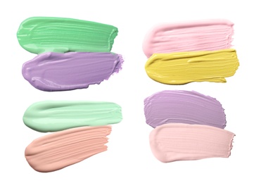 Image of Set with strokes of color correcting concealers on white background, top view