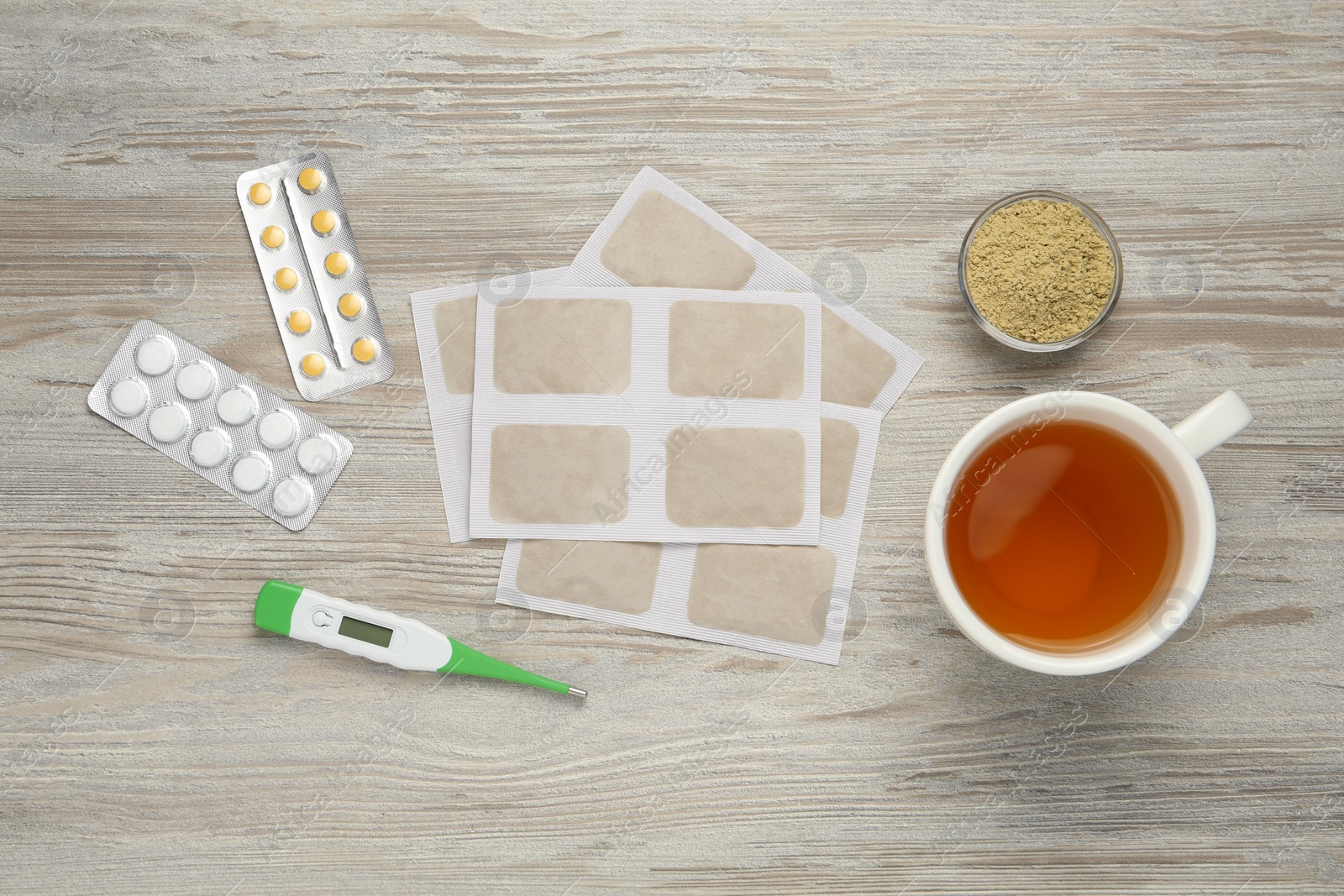 Photo of Flat lay composition with mustard plasters on wooden table