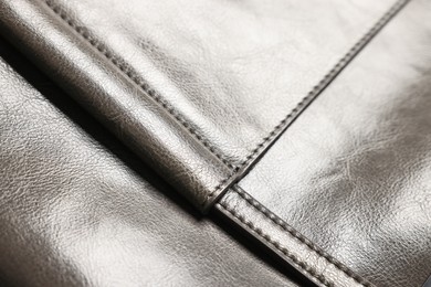 Photo of Natural leather with seams as background, closeup