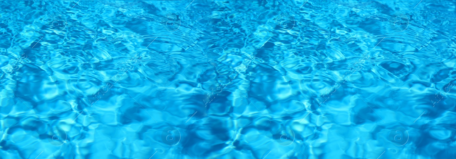 Image of Texture of blue water in swimming pool as background. Banner design