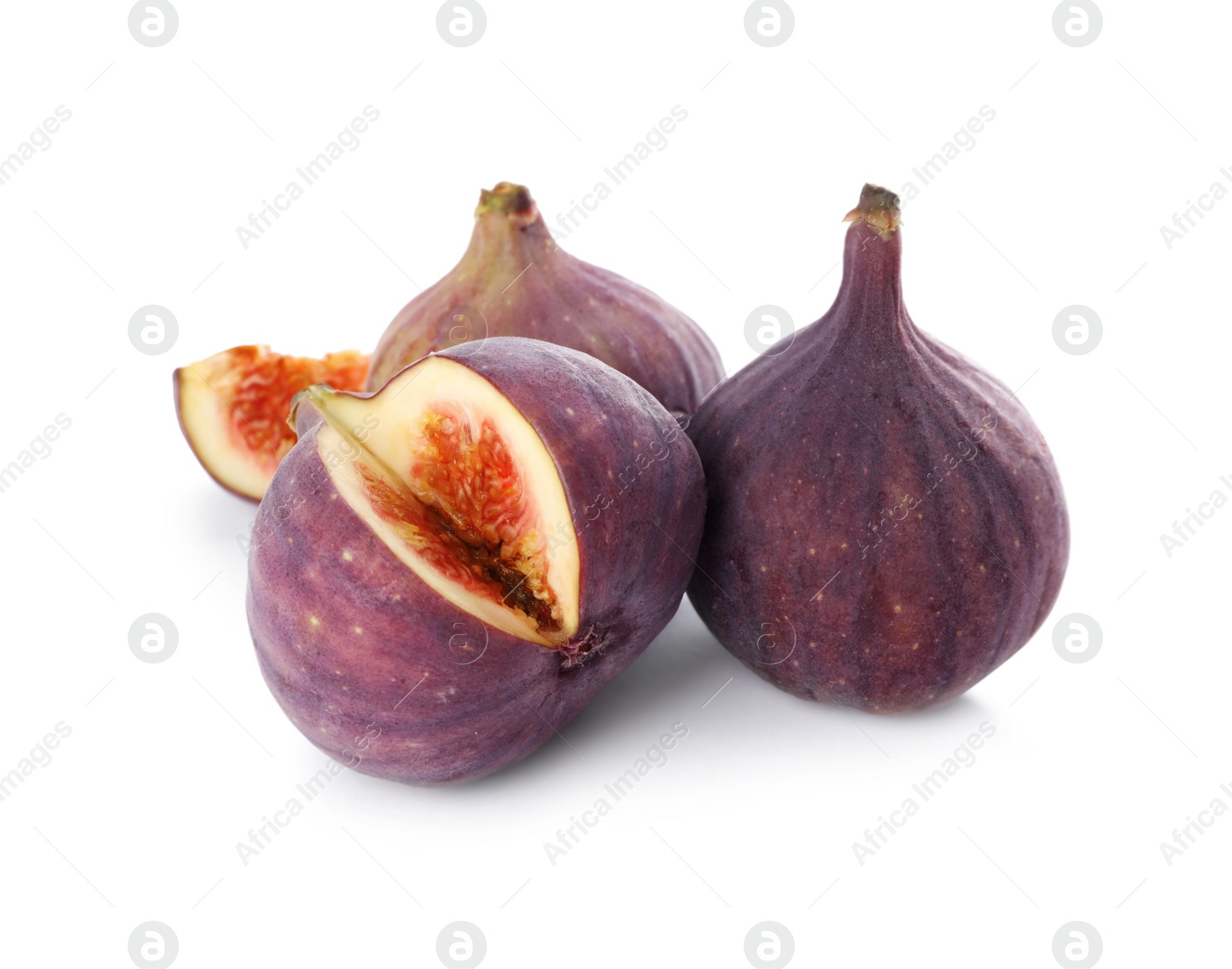 Photo of Whole and cut tasty fresh figs isolated on white