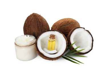 Organic coconut cooking oil, fresh fruits and green leaf isolated on white
