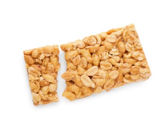 Photo of Pieces of tasty peanut bar (kozinaki) isolated on white, top view
