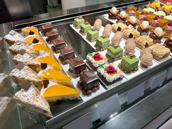 Photo of Showcase with different tasty desserts in store