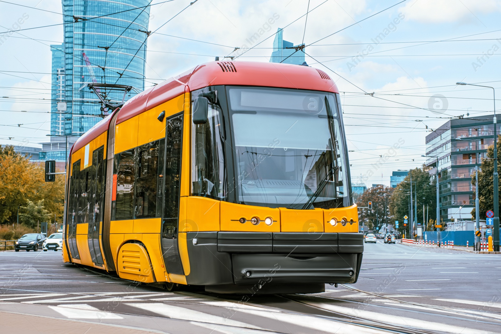 Photo of Modern tram on city street. Public transport