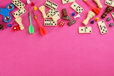 Photo of Components of board games on pink background, flat lay. Space for text