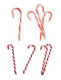 Set of tasty Christmas candy canes on white background