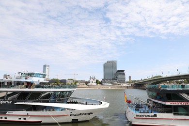 Cologne, Germany - August 28, 2022: Beautiful ferry boats on river