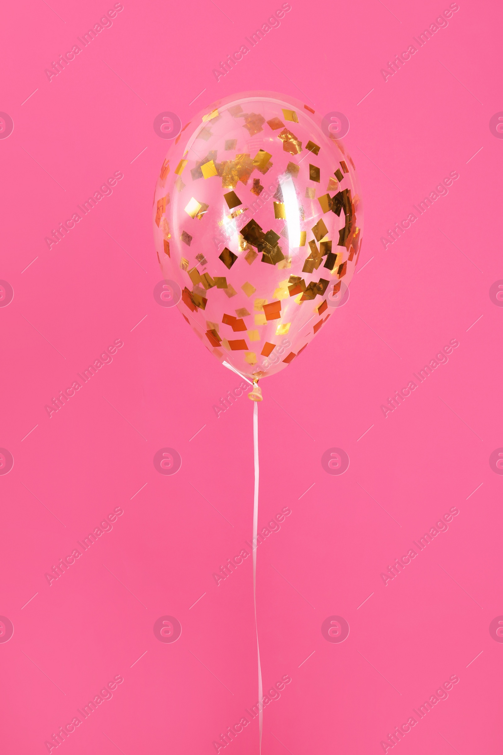 Photo of Bright balloon with sparkles on color background