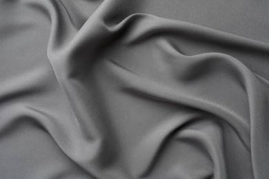 Photo of Texture of grey crumpled silk fabric as background, top view