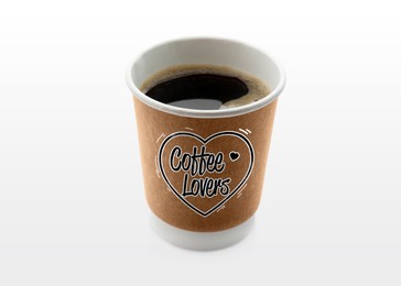 Image of Takeaway paper cup with printed phrase Coffee Lovers isolated on white