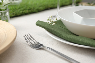 Photo of Elegant fork on table, closeup. Festive setting